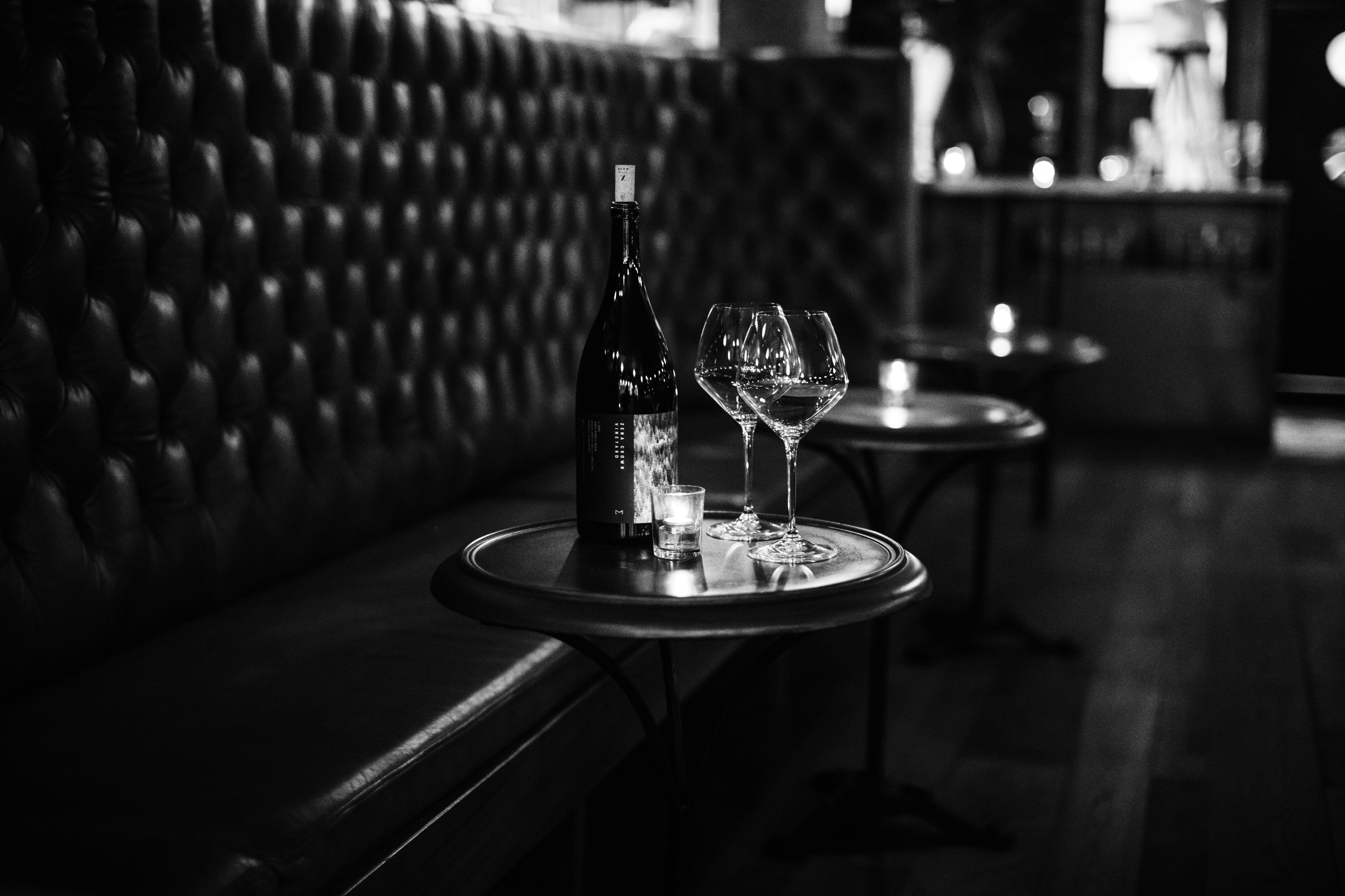 Zena Crown bottle with 2 glasses of wine